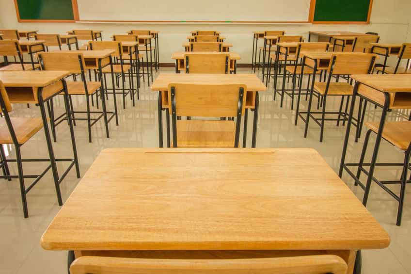 Lecture room or School empty classroom with desks and chair iron wood in high school thailand, interior of secondary school education, with whiteboard, vintage tone educational concept
